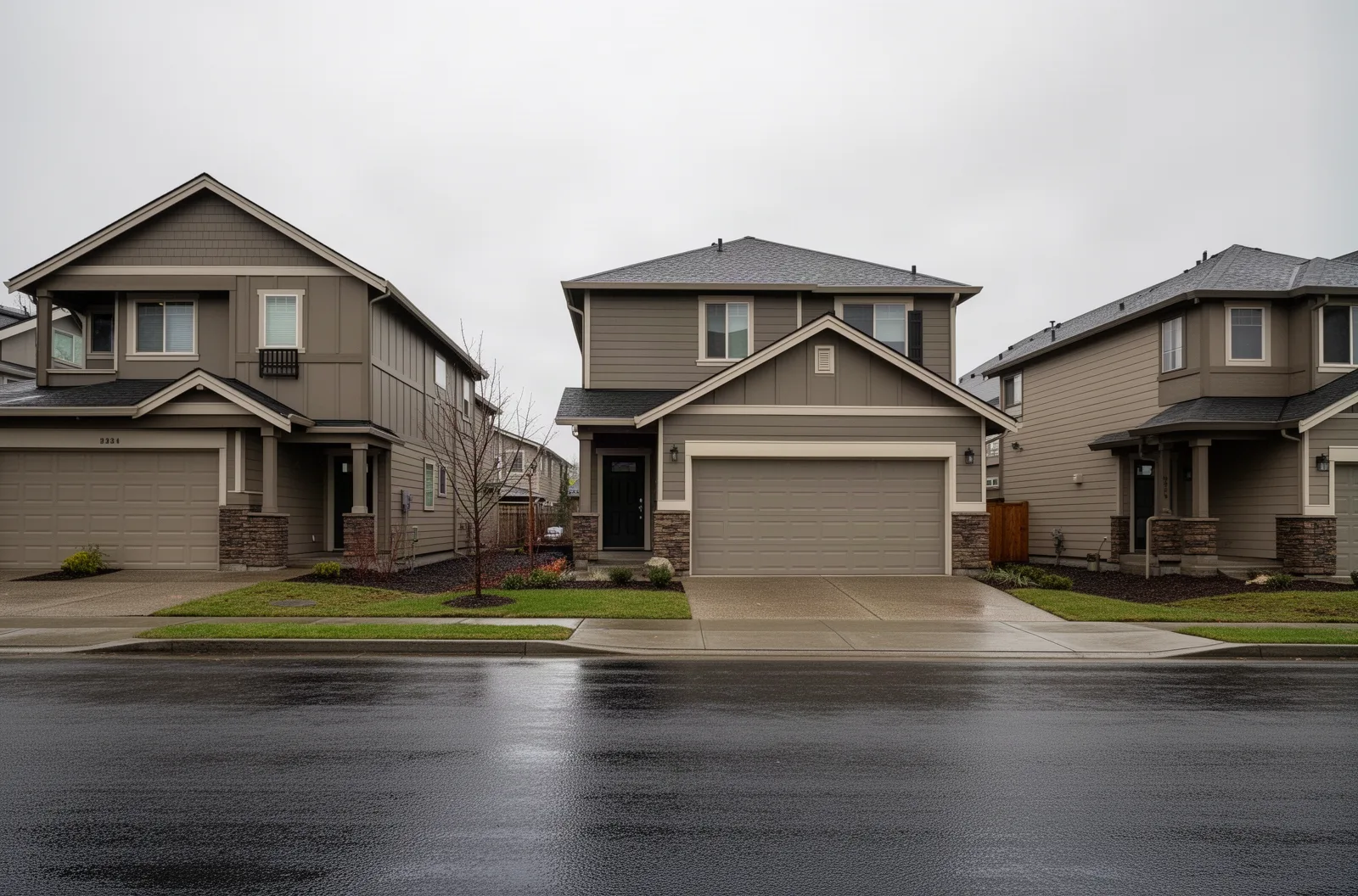 A newer Hillsboro subdivision street of front-facing garages