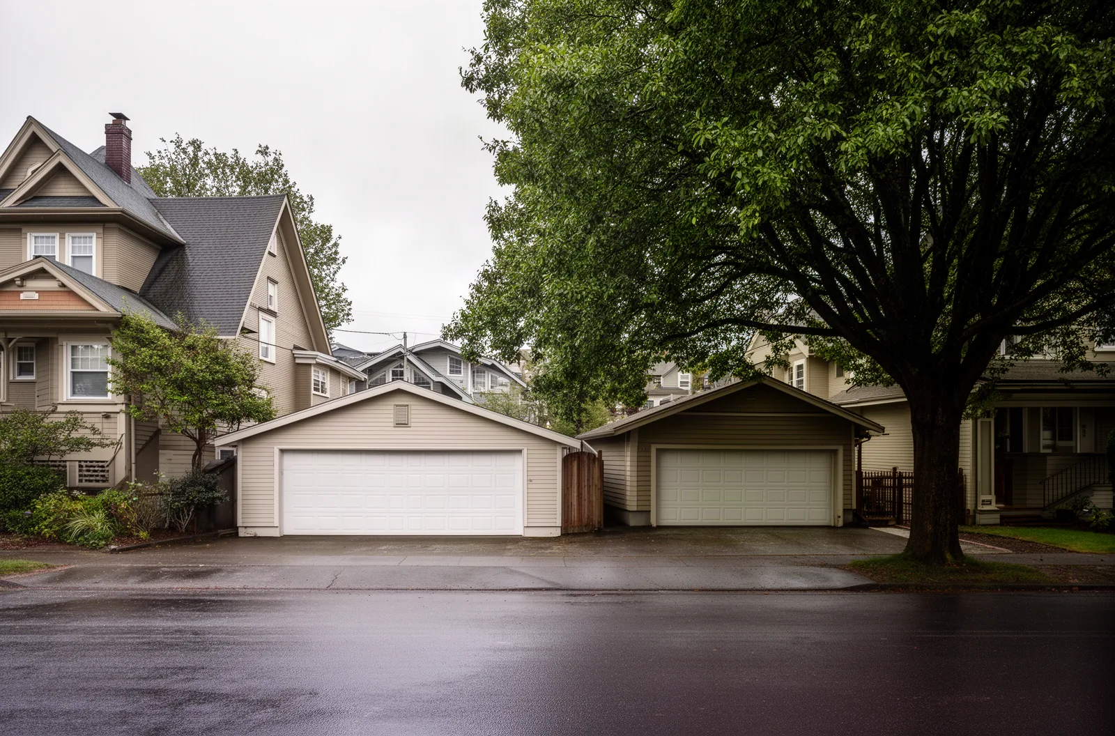 A Portland residential street with detached garages behind houses